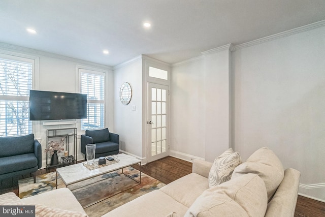 living room featuring dark wood-type flooring, baseboards, ornamental molding, and recessed lighting
