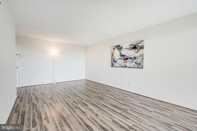 2311 Pimmit Dr Unit 1102, Falls Church, VA 22043 - unfurnished room with wood finished floors and a textured ceiling