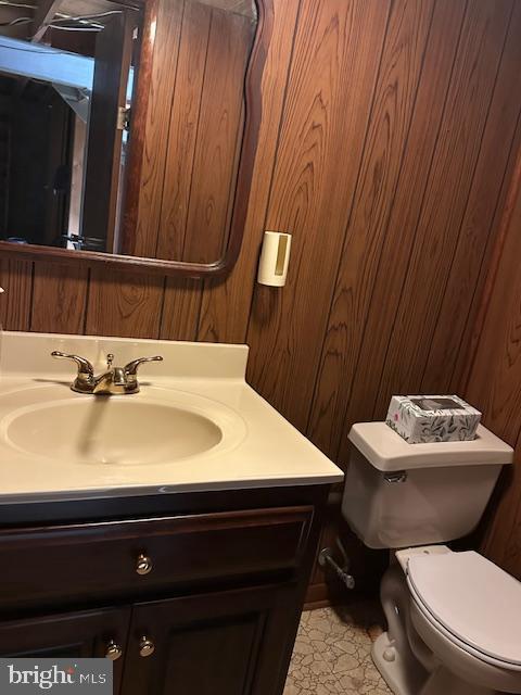355 George St, Hanover, PA 17331 - half bath with vanity, toilet, and wood walls