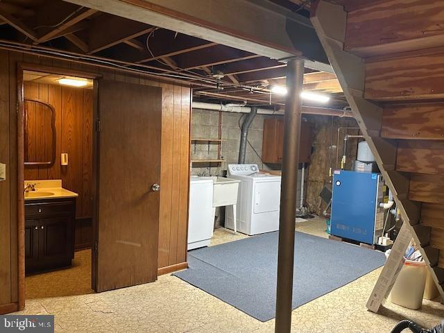 355 George St, Hanover, PA 17331 - below grade area with washer and clothes dryer, a sink, stairs, and heating unit