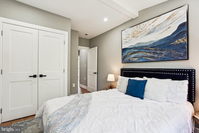 1014 Kearny St NE, Washington, DC 20017 - bedroom featuring baseboards, beam ceiling, wood finished floors, and a closet