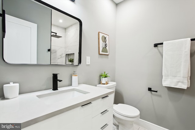 1014 Kearny St NE, Washington, DC 20017 - bathroom featuring vanity, baseboards, a shower, and toilet