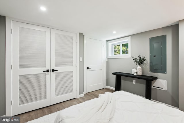 1014 Kearny St NE, Washington, DC 20017 - bedroom featuring electric panel, recessed lighting, baseboards, wood finished floors, and a closet