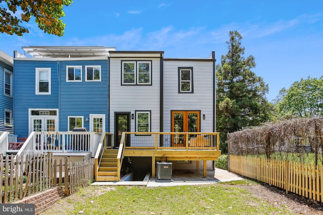 1014 Kearny St NE, Washington, DC 20017 - back of property with stairs, a fenced backyard, a wooden deck, and central AC unit