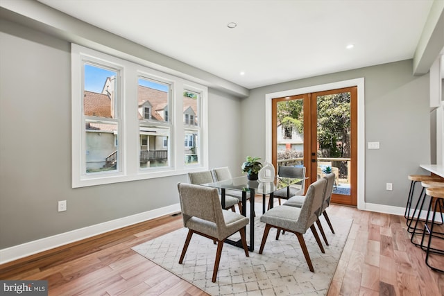 1014 Kearny St NE, Washington, DC 20017 - dining room featuring french doors, baseboards, and light wood-type flooring