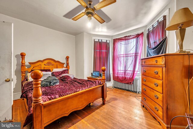 4910 N Hutchinson St, Philadelphia, PA 19141 - bedroom featuring ceiling fan, radiator, and wood finished floors