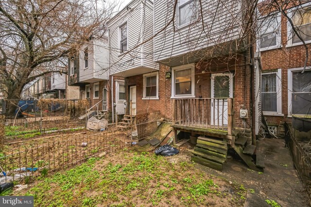 4910 N Hutchinson St, Philadelphia, PA 19141 - back of property featuring fence and brick siding