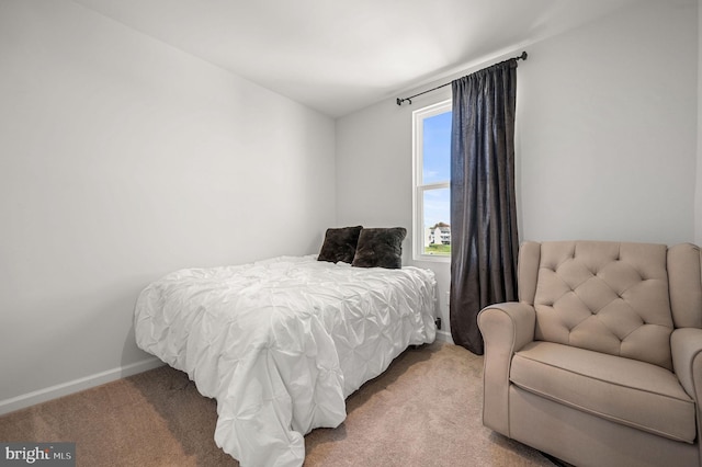 bedroom with carpet and baseboards