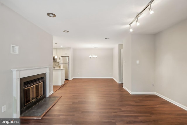 2816 Lee Oaks Pl Unit 102, Falls Church, VA 22046 - unfurnished living room featuring baseboards, an inviting chandelier, a glass covered fireplace, dark wood-style flooring, and recessed lighting