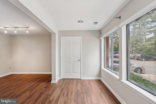 2816 Lee Oaks Pl Unit 102, Falls Church, VA 22046 - unfurnished bedroom with visible vents, wood finished floors, and baseboards