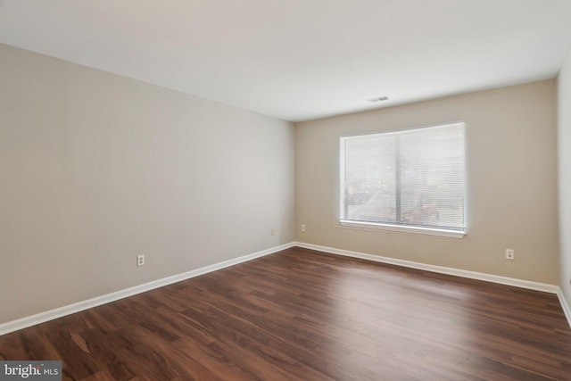 2816 Lee Oaks Pl Unit 102, Falls Church, VA 22046 - empty room featuring dark wood-style flooring, visible vents, and baseboards