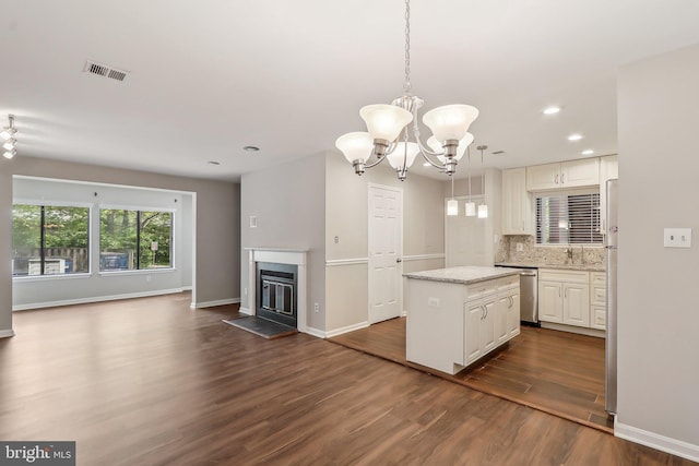 2816 Lee Oaks Pl Unit 102, Falls Church, VA 22046 - kitchen with a chandelier, a kitchen island, dark wood-style flooring, visible vents, and open floor plan