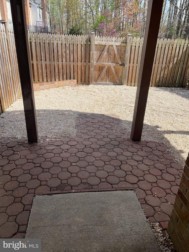 view of patio / terrace featuring fence