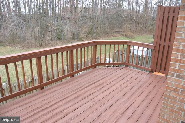 wooden deck with a lawn