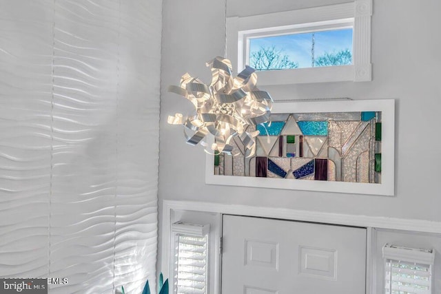 details with an inviting chandelier