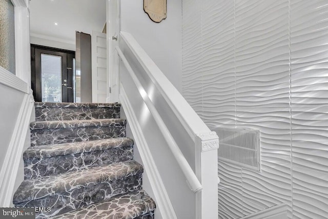 stairway with crown molding