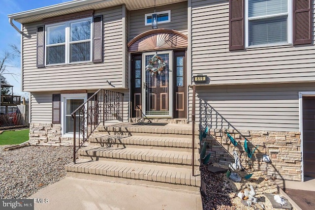 view of exterior entry with stone siding