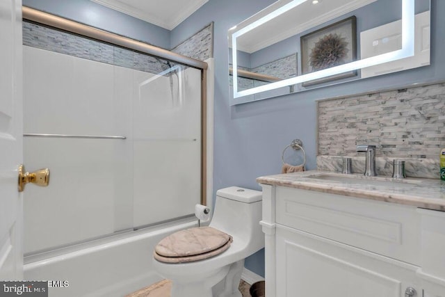 bathroom featuring shower / bath combination with glass door, vanity, crown molding, toilet, and decorative backsplash