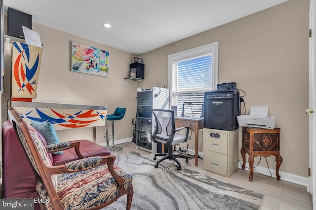 office space with baseboards, recessed lighting, and wood finished floors