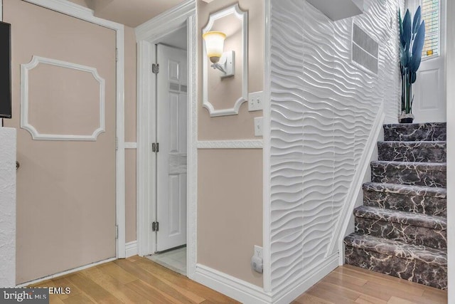 stairs with wood finished floors
