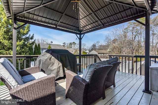 wooden deck featuring a gazebo
