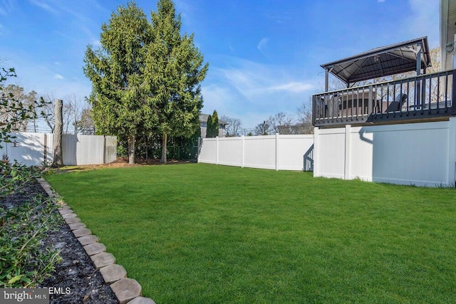 view of yard featuring a gazebo and a fenced backyard