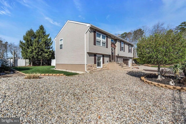 exterior space featuring a yard and fence