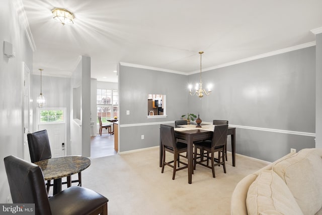 dining room with baseboards, crown molding, light colored carpet, and a notable chandelier