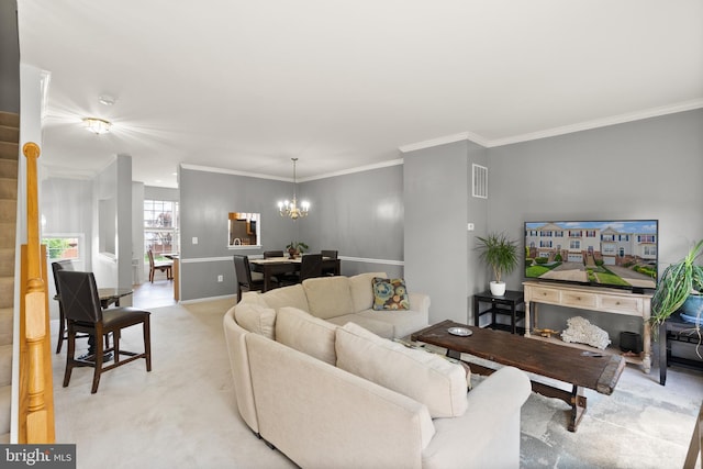 living room featuring a chandelier, visible vents, ornamental molding, and light carpet