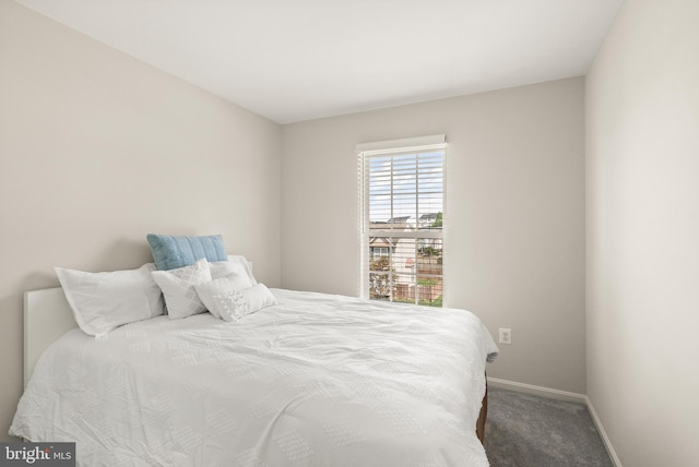 bedroom with baseboards and carpet flooring