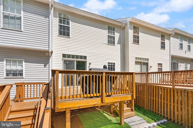rear view of house with a wooden deck