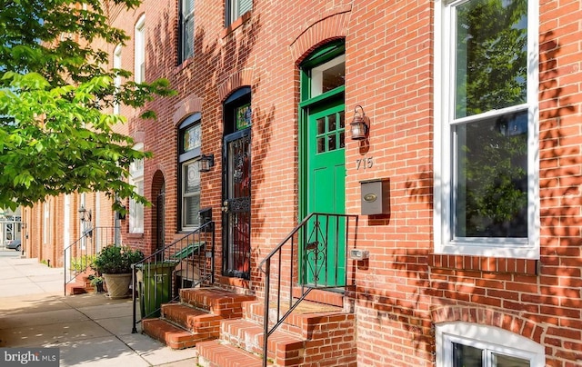 entrance to property with brick siding