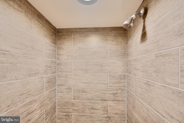 details with a tile shower