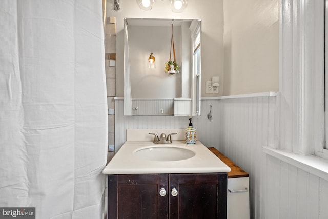 bathroom featuring vanity and wainscoting