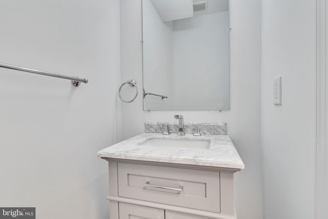 bathroom featuring vanity and visible vents