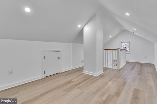 bonus room with light wood-style floors, lofted ceiling, and recessed lighting