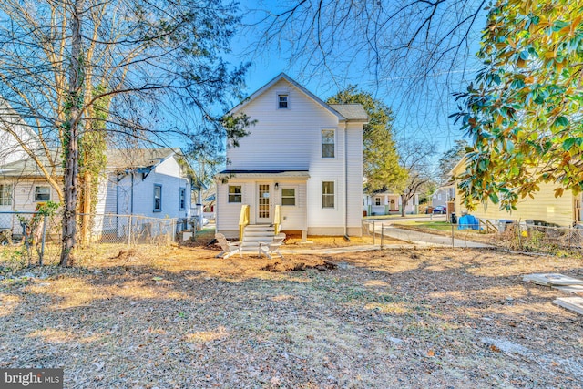 view of front of house featuring fence