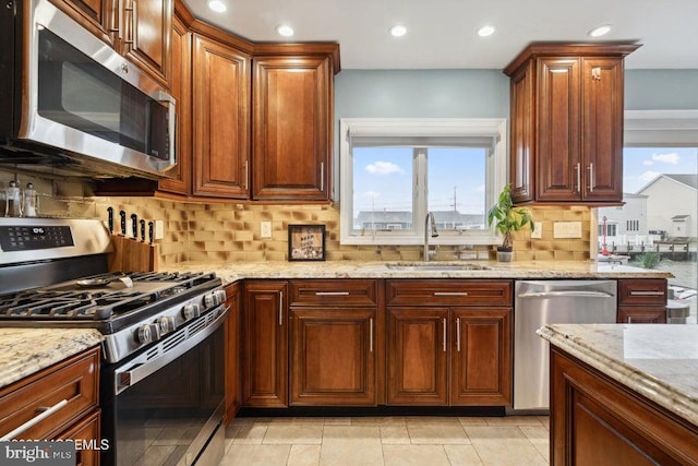 823 Forepeak Dr, Forked River, NJ 08731 - kitchen with a sink, light stone counters, and stainless steel appliances