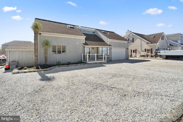 823 Forepeak Dr, Forked River, NJ 08731 - view of front of property with concrete driveway, a garage, and a shingled roof