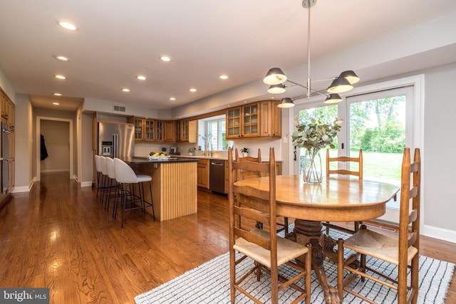 dining room with recessed lighting, dark wood finished floors, and baseboards