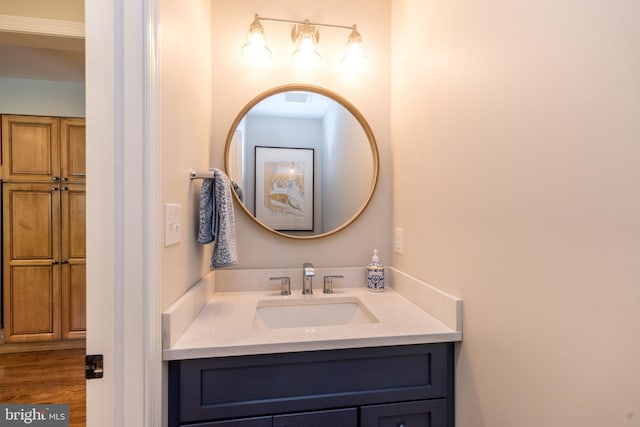 bathroom with vanity and wood finished floors