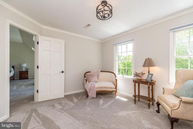 sitting room featuring carpet flooring, healthy amount of natural light, baseboards, and crown molding