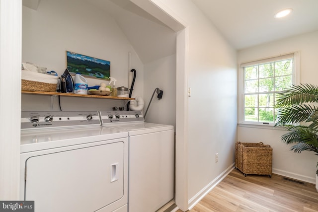 washroom with washer and dryer, light wood-style floors, baseboards, and recessed lighting