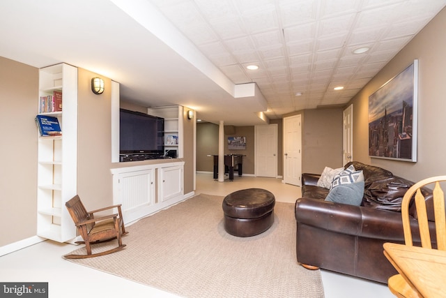 living room featuring recessed lighting and built in shelves