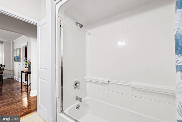 full bath featuring bathtub / shower combination and wood finished floors