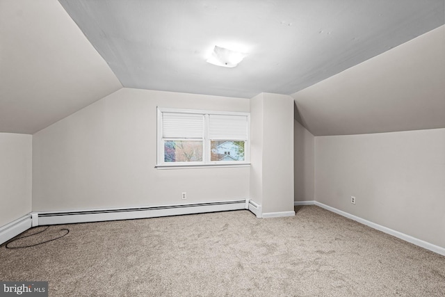 bonus room with carpet floors, baseboards, a baseboard heating unit, and lofted ceiling