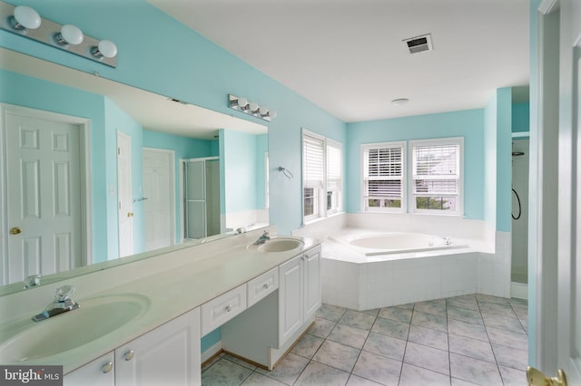 33 General Early Dr, Harpers Ferry, WV 25425 - bathroom featuring a garden tub, double vanity, a shower stall, and tile patterned flooring