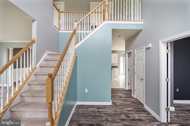 33 General Early Dr, Harpers Ferry, WV 25425 - staircase featuring a towering ceiling and wood finished floors