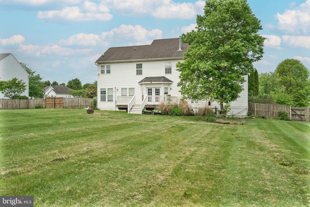 33 General Early Dr, Harpers Ferry, WV 25425 - back of property with a deck, a fenced backyard, and a shingled roof