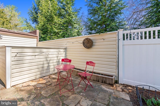 view of patio featuring fence